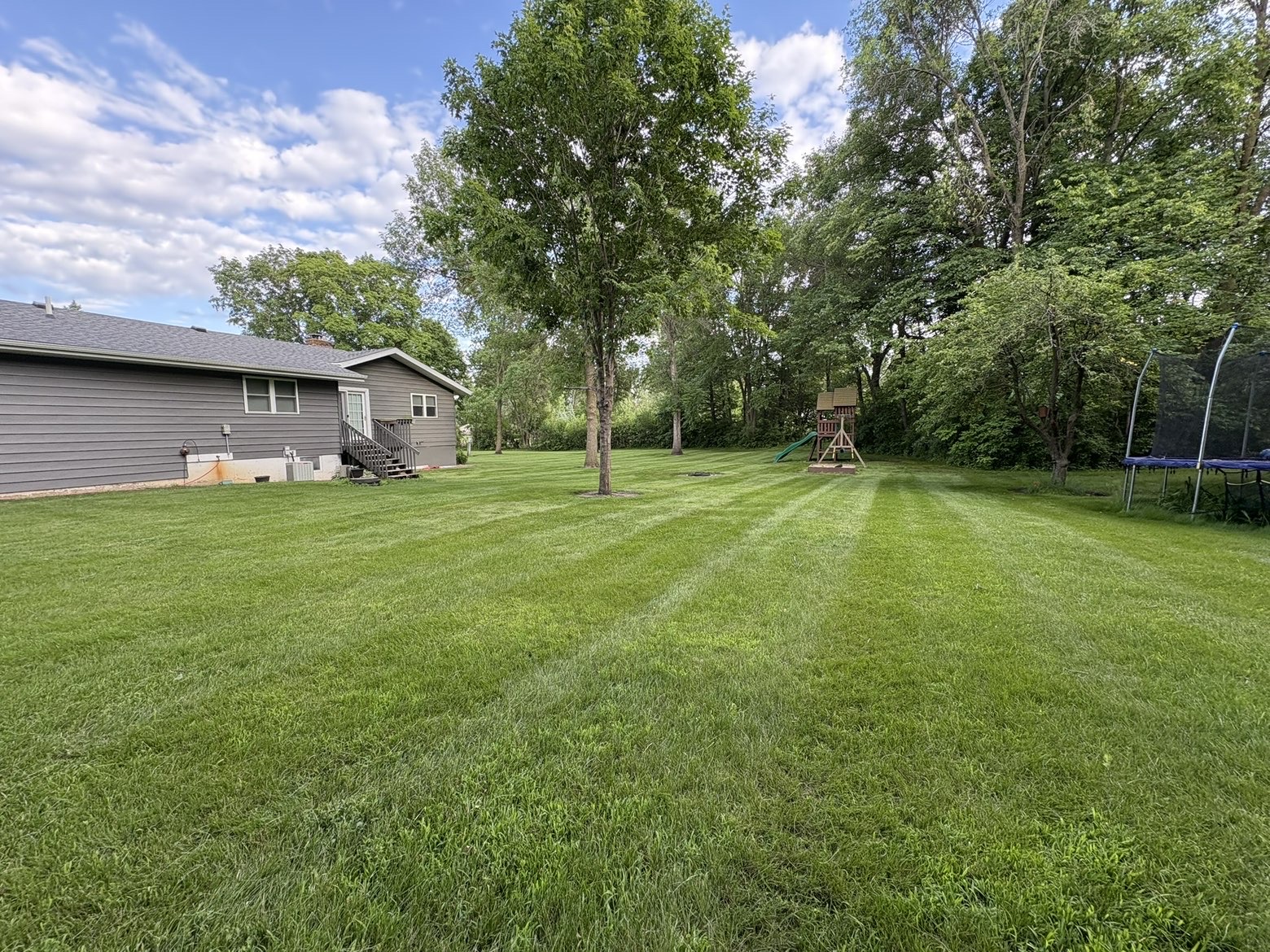 Freshly mowed lawn with crisp diagonal stripes in Osakis, MN